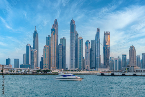Scenic view of Dubai Marina Skyscrapers with big boat, Skyline, View from Palm Beach, United Arab Emirates