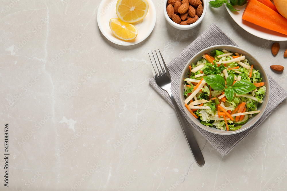 Delicious turnip salad served on light grey table, flat lay. Space for text Delicious turnip salad served on light grey table, flat lay. Space for text