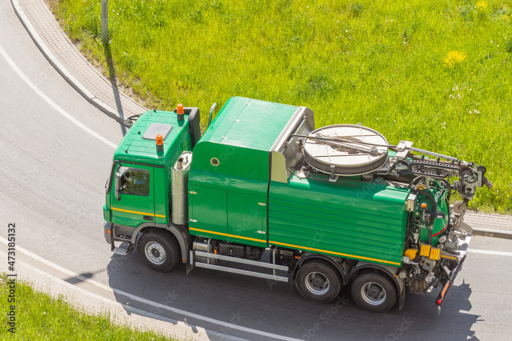 Duction machine for a city water utility for washing sludge on the side of a highway for cleaning underground infrastructure, removing blockages in sewage wastewater entering the collector.