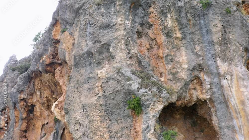 Close up of eroded rocky cliff. Rough textured rock. Close up of eroded rocky cliff. Rough textured rock.