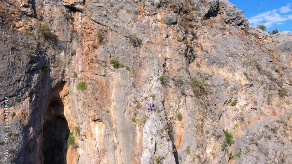 Rock climbers climbing on the cliff. Aerial view from drone. Rock climbers climbing on the cliff. Aerial view from drone.