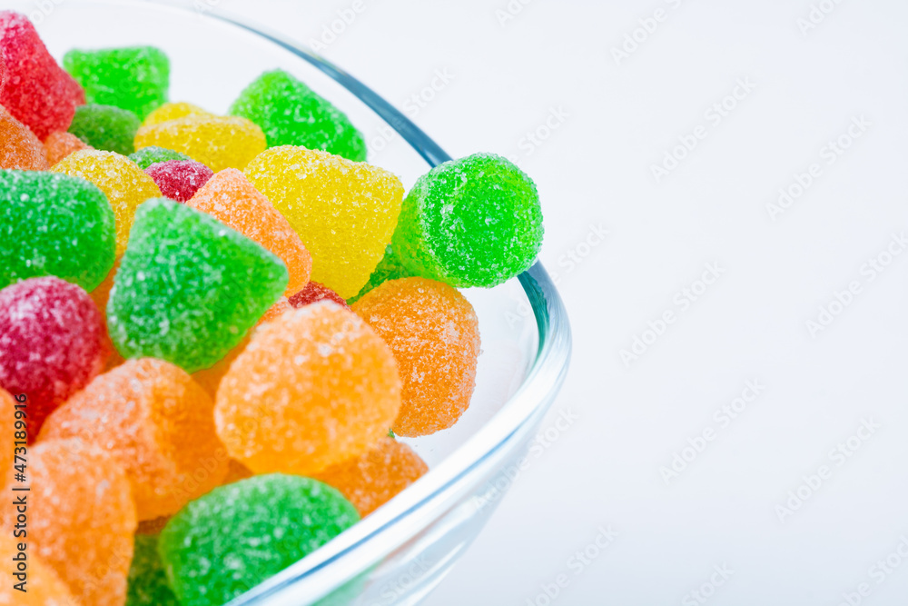 Gummy candies. Gummy jelly candies in a glass bowl isolated on white background Gummy candies. Gummy jelly candies in a glass bowl isolated on white background