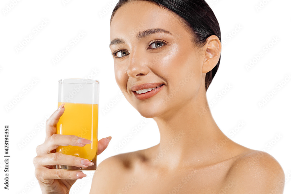 Beautiful young woman with a glass of orange juice drinking fresh orange juice on an isolated white background Beautiful young woman with a glass of orange juice drinking fresh orange juice on an isolated white background