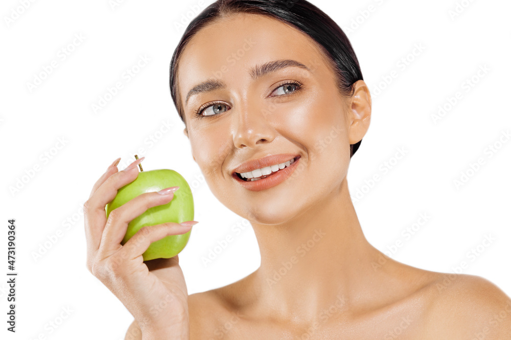 Portrait of a beautiful young woman with a perfect smile, smiling woman with healthy teeth holding a green apple Portrait of a beautiful young woman with a perfect smile, smiling woman with healthy teeth holding a green apple