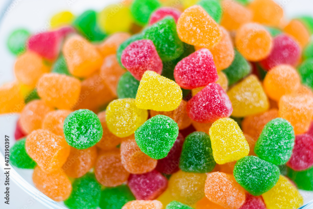 Jelly candies on the bowl in focus. Selective focus on candies in the bowl. Jelly candies on the bowl in focus. Selective focus on candies in the bowl.