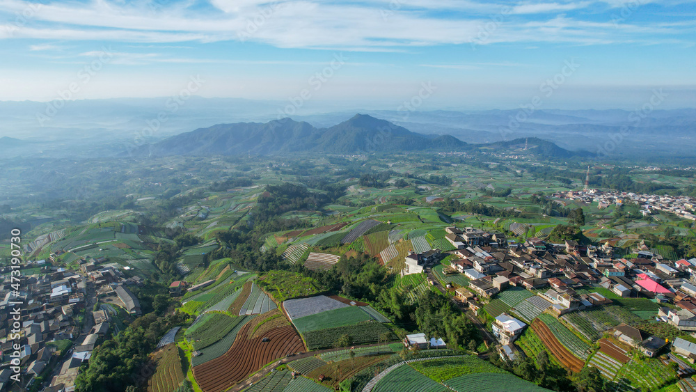 Aerial view of the Nepal van java is a Rural tour on the slopes of mount sumbing, The beauty of building houses in the countryside of the mountainside. Magelang, Indonesia Aerial view of the Nepal van java is a Rural tour on the slopes of mount sumbing, The beauty of building houses in the countryside of the mountainside. Magelang, Indonesia