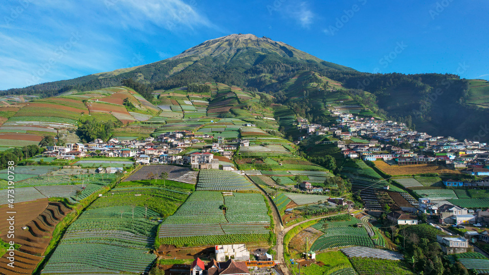 Aerial view of the Nepal van java is a Rural tour on the slopes of mount sumbing, The beauty of building houses in the countryside of the mountainside. Magelang, Indonesia