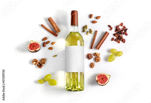White wine and possibble ingredients of grape, cinnamon, figs isoalted on white background