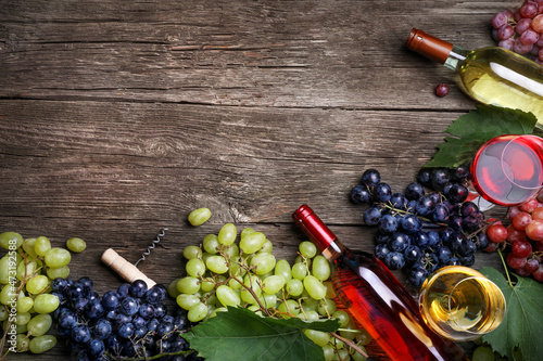 Grape and wine on wooden background. Top view