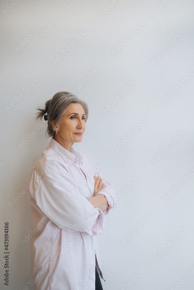 Smiling confident middle aged business woman on white background. Smiling confident middle aged business woman on white background.