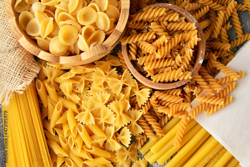 composition of raw pasta and spaghetti different shapes, frame of raw pasta. room for text	
 photo