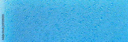 blue background with water drops close-up in banner format