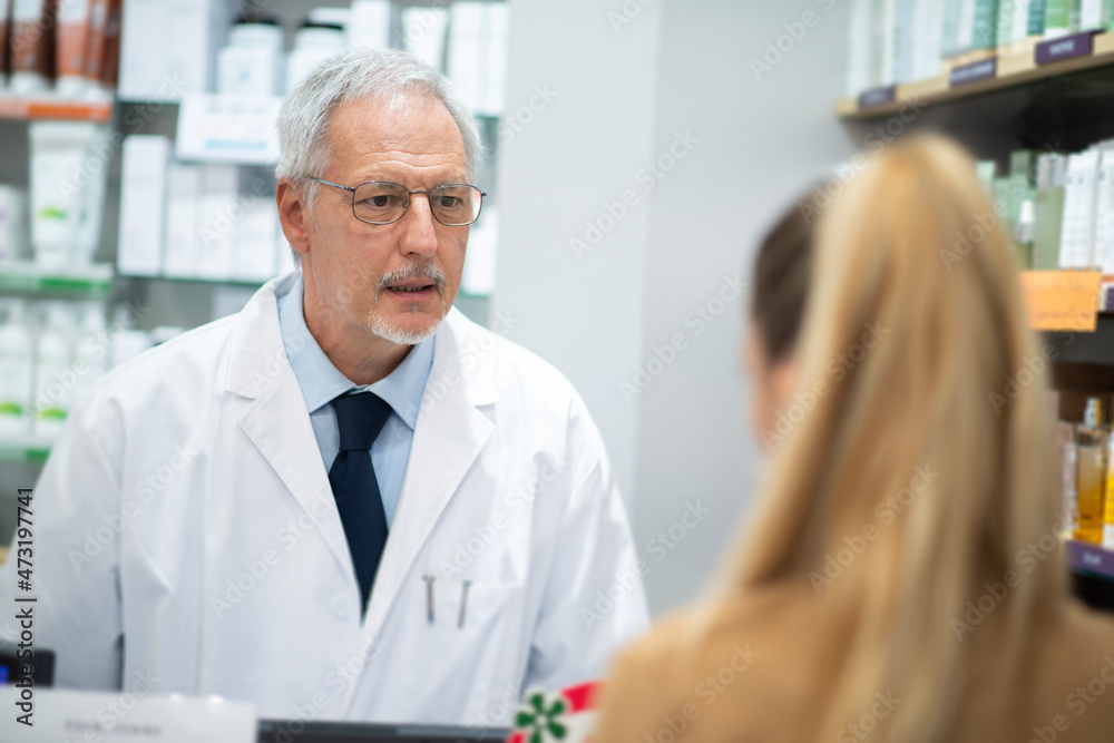 Pharmacist suggesting a product to a customer