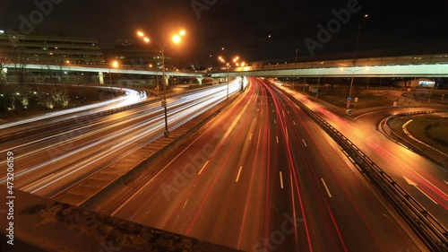 timelapse with tracers of traffic at night on the MKAD highway Kashirskoe highway at the intersection with Mozhayskoe highway, Moscow, Russia photo