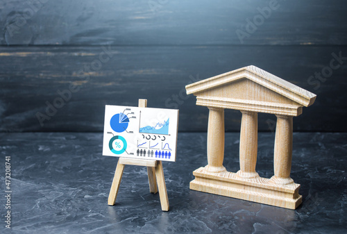 Fotografie Bank or government building and statistics easel