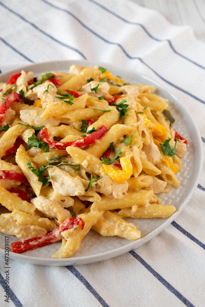 Homemade One Pot Chicken Fajita Pasta on a Plate, low angle view. Homemade One Pot Chicken Fajita Pasta on a Plate, low angle view.