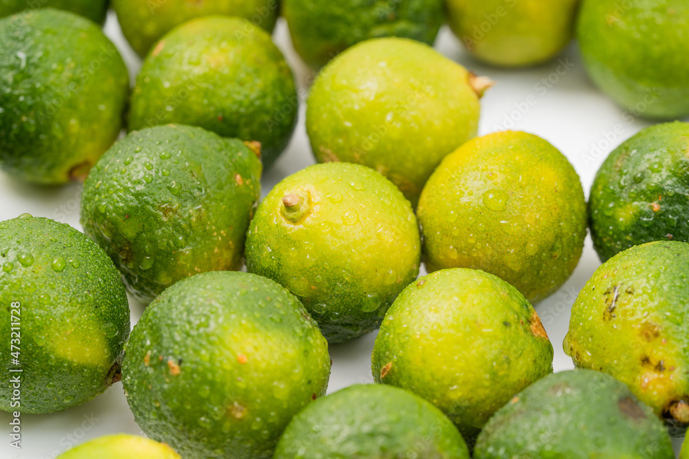 Fresh little limes on pure white background Fresh little limes on pure white background