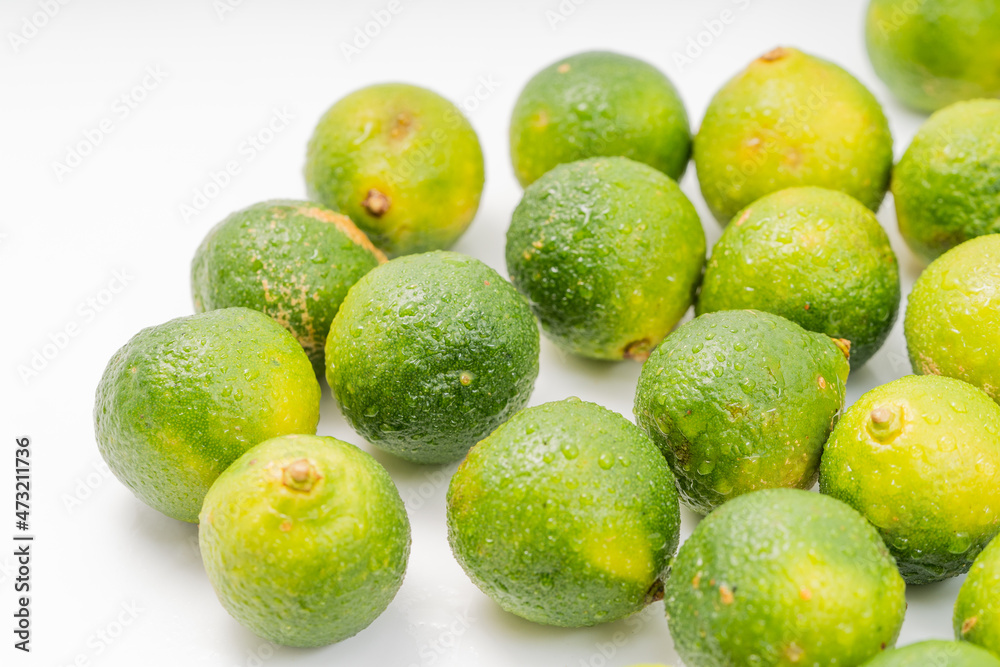 Fresh little limes on pure white background Fresh little limes on pure white background