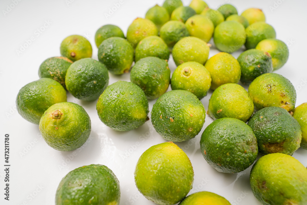 Fresh little limes on pure white background Fresh little limes on pure white background