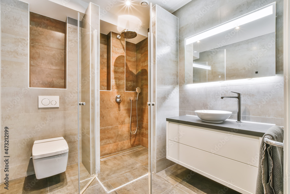 Ταπετσαρία Flush toilet and shower cabin with glass partition in washroom at home