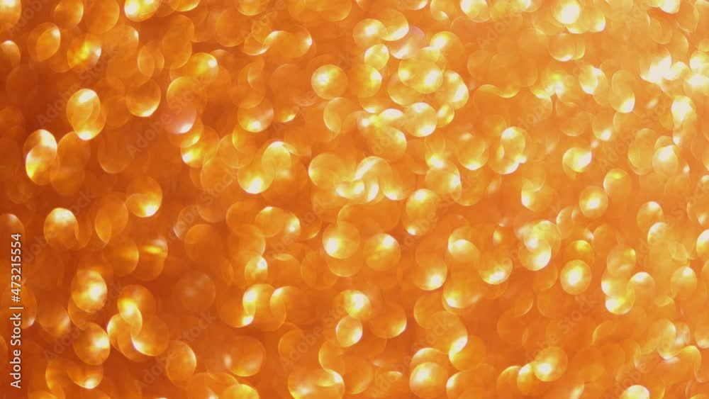 moving gold defocused blurred glitter lights background. abstract yellow holiday concept mood. bloating and decreasing motion increasing dots bokeh in seamless loop. moving gold defocused blurred glitter lights background. abstract yellow holiday concept mood. bloating and decreasing motion increasing dots bokeh in seamless loop.