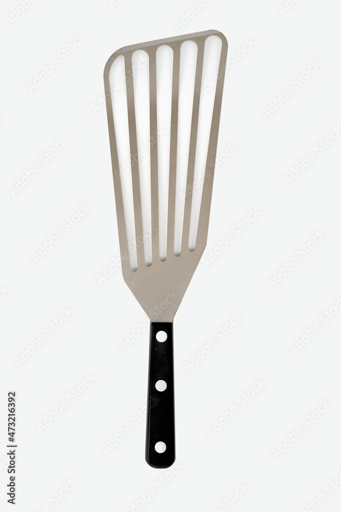 Chef's Right Handed Slotted Turner Spatula with Black Handle on a White Background Chef's Right Handed Slotted Turner Spatula with Black Handle on a White Background