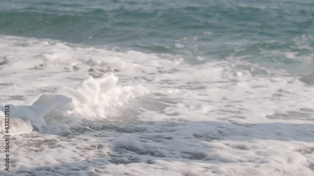 Young couple running and having fun by the sea. They run with bare feet in the sea and on the sand. Summer, vacation and beach concept Young couple running and having fun by the sea. They run with bare feet in the sea and on the sand. Summer, vacation and beach concept