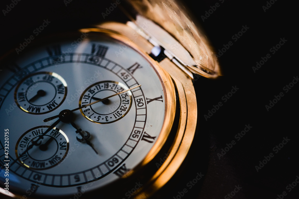 Golden luxury pocket watch. Extreme macro close up, black and white. Golden luxury pocket watch. Extreme macro close up, black and white.