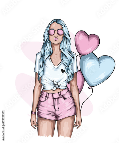 Beautiful girl in stylish clothes and balloons-hearts. Love and valentine's day. Fashion and style, clothing and accessories.