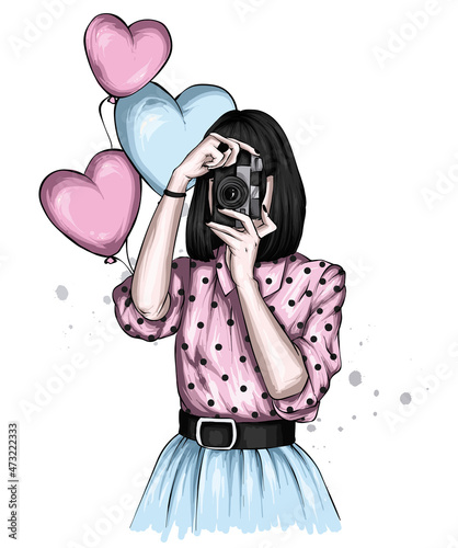 Beautiful girl in stylish clothes and balloons-hearts. Love and valentine's day. Fashion and style, clothing and accessories.