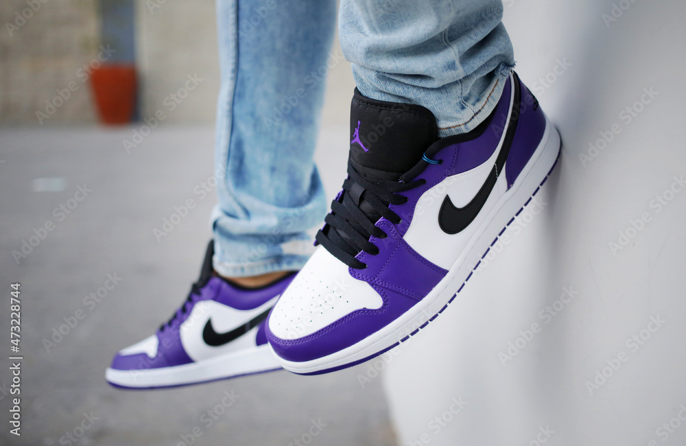 Young guy Nike Air Jordan 1 Low court purple white, Jalisco, Mexico, 2021  Stock Photo | Adobe Stock