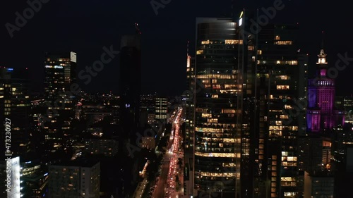 Wallpaper Mural Forwards fly around downtown skyscrapers at night. Traffic jam in street bellow. Endless stream of car lights. Warsaw, Poland Torontodigital.ca