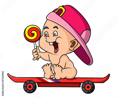 The baby with the candy is playing the skateboard
