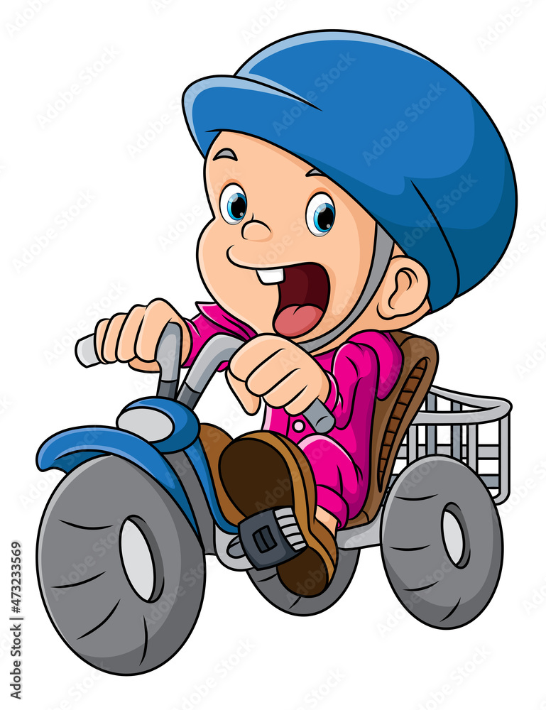 Naklejka premium The boy is riding a bike with helmet