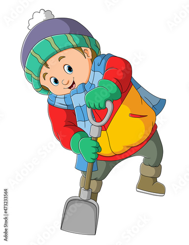 The handsome boy is digging with shovel
