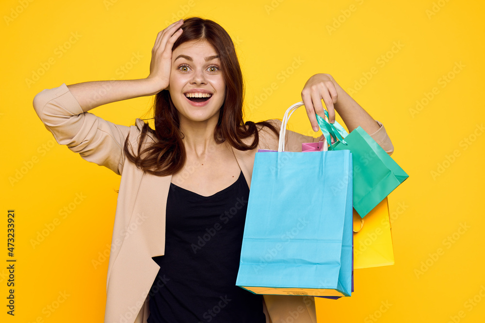 cheerful woman shopping entertainment lifestyle yellow background cheerful woman shopping entertainment lifestyle yellow background