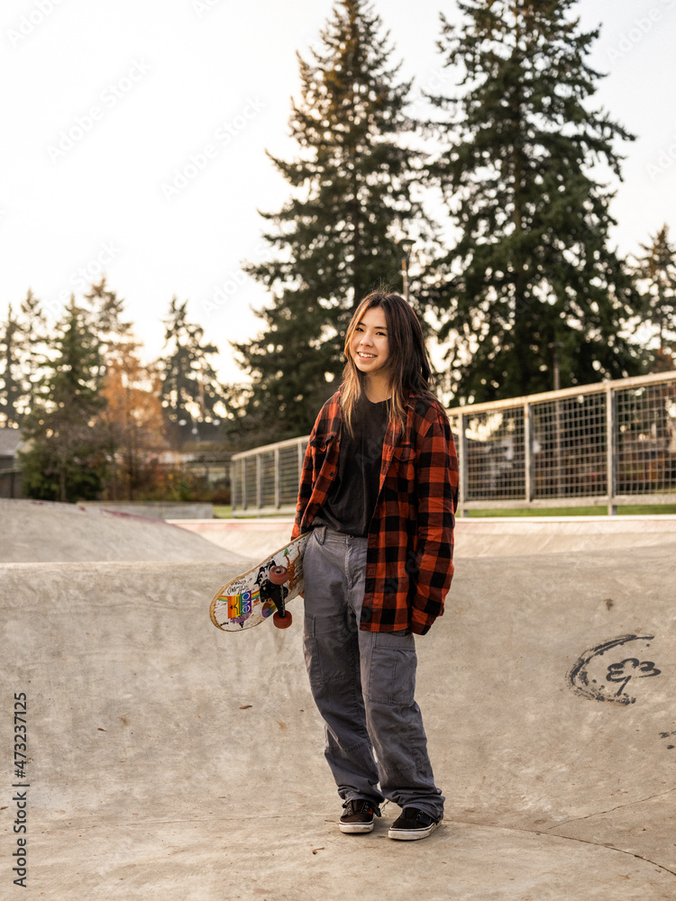 Young Indigenous nonbinary skater outdoors Stock Photo Adobe Stock