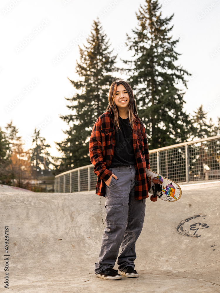 Young Indigenous nonbinary skater outdoors Stock Photo Adobe Stock