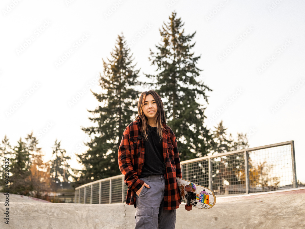 Young Indigenous nonbinary skater outdoors Stock Photo Adobe Stock