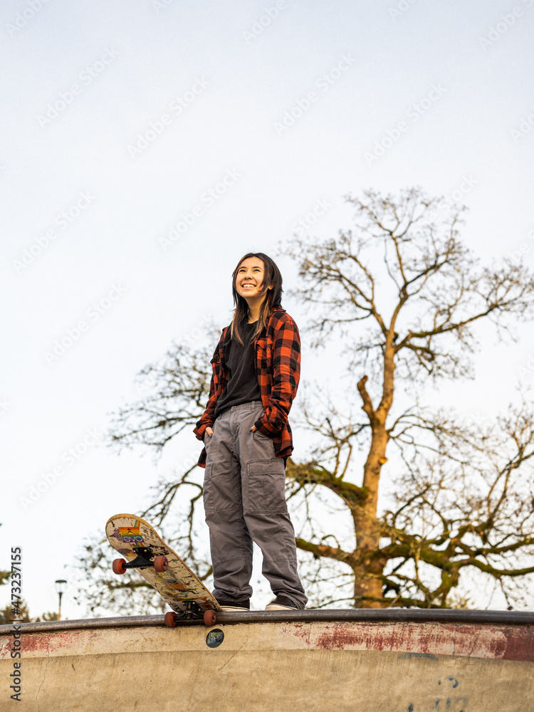 Young Indigenous nonbinary skater outdoors Stock Photo Adobe Stock