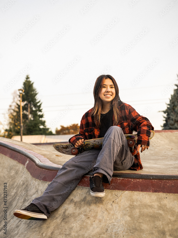 Young Indigenous nonbinary skater outdoors Stock Photo Adobe Stock