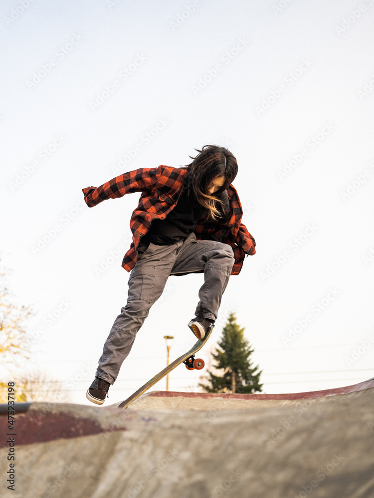 Young Indigenous nonbinary skater outdoors Stock Photo Adobe Stock