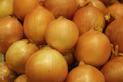 Heap of bulb onions selling on the market