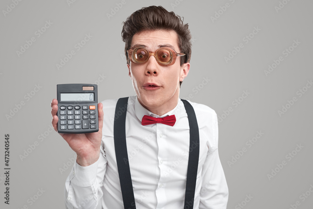 Comic accountant with calculator in studio