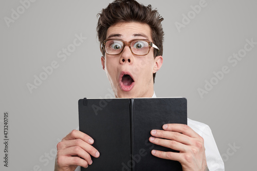 Canvas Print Shocked funny student with book