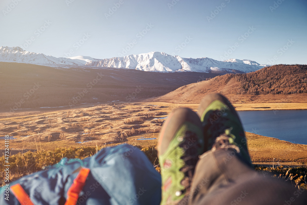 Fototapeta premium Feet Hiker relaxing enjoying view entrance outdoor. Travel Lifestyle concept adventure vacations outdoor.