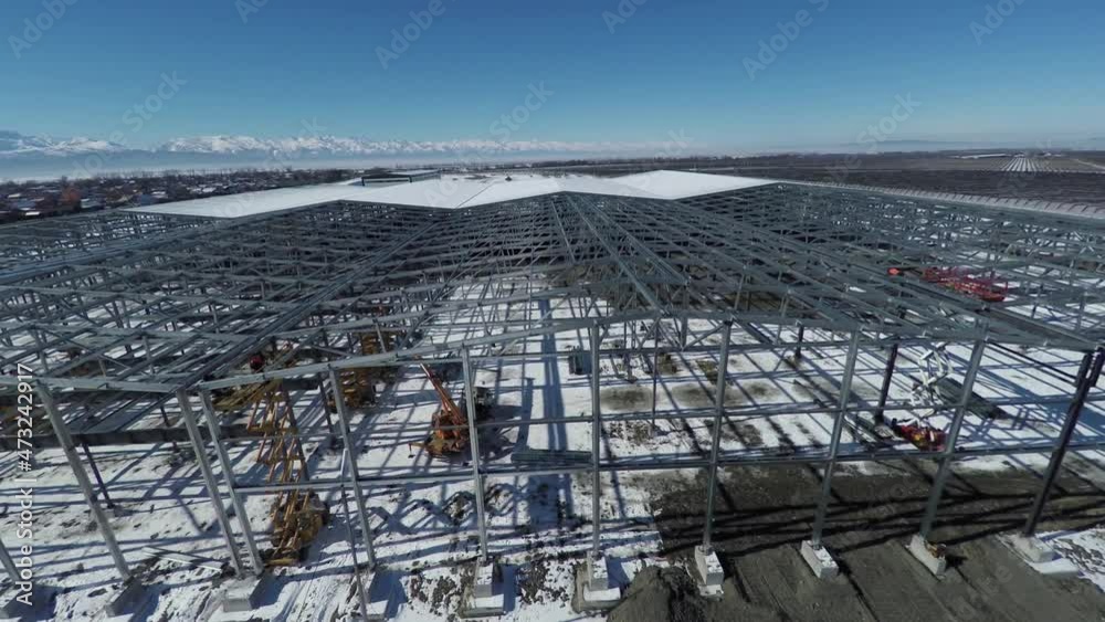 Apple orchard. Vegetable storage under construction. Apple orchard. Vegetable storage under construction.