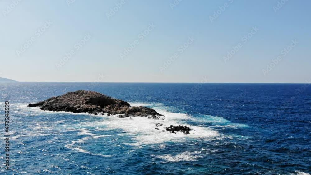 Seascape With Foamy Waves Splashing On Rocks At Jerusalem Beach In Greece - aerial drone shot Seascape With Foamy Waves Splashing On Rocks At Jerusalem Beach In Greece - aerial drone shot