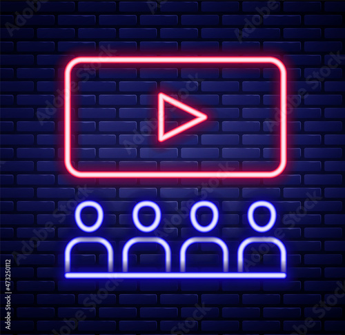 Glowing neon line Cinema auditorium with screen icon isolated on brick wall background. Colorful outline concept. Vector