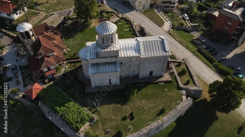 Aerial View of Orthodox Church in Downtown Arilje, Serbia. Landmark on Sunny Summer Day, Birdseye Drone Shot photo